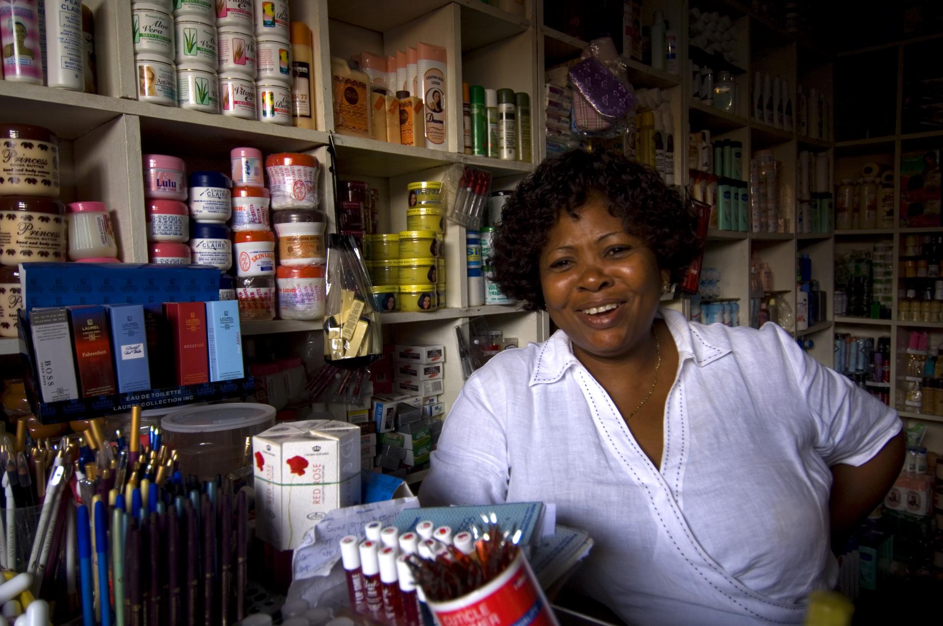 A woman working in a small shop in Ghana. (Photo:  World Bank, Arne Hoel)